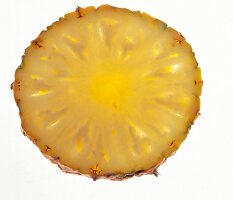Thin slice of pineapple on white background