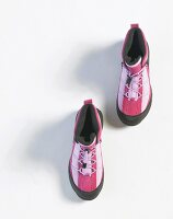 Pair of pink running shoes on white background
