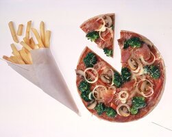 Paper bag with french fries and pizza with broccoli and onions on white background
