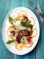 Apple, radish and carpaccio with fillet on plate