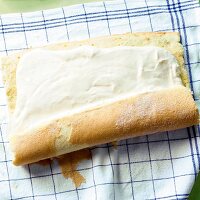 Sponge roll being rolled on cloth