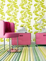 Leather chair and roll containers in front of flocked green leaves wallpaper