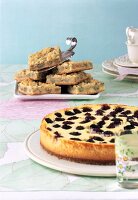 Close-up of blackberry cheese cake and gooseberry pie
