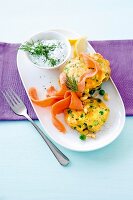 Noodle and pea pancakes served with salmon cream