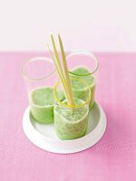 Close-up of three glasses of cucumber and wasabi smoothie on tray