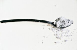 A spoon with silica on white background