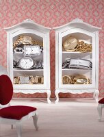 Set of gold and silver watches in two dollhouse cabinets