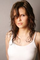 Portrait of pensive Magdalena woman with wet brown hair
