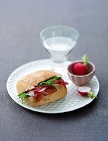 Sandwich with ciabatta bun and vegetable on white plate