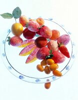 Close-up of fruits and Easter eggs on glass plate