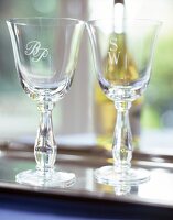 Two engraved wine glasses with initials