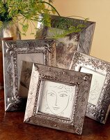 Several picture frames on table