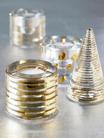 Golden and silver patterned lanterns with lit candles