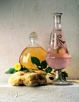 Glass bottle, Carafe, Sponge and yellow rose kept against white background