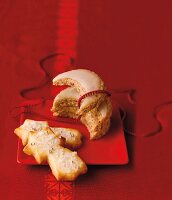 Hazelnut moons and sour cream biscuits on a red plate