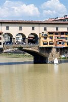View of Ponte Vecchio bridge over Arno river in Florence, Italy