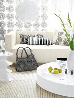 Creme carpet and sofa with black and white patterned cushions