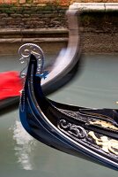 Close-up of tip of Gondola with ornate decoration at Venice, Italy