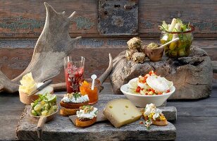 Cheese and cheese dishes on wooden board