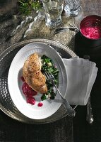 Swordfish fillet with chard and beetroot vinaigrette on plate