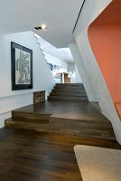 Staircase with oak wooden flooring in living room