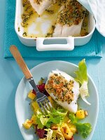Cod fillet with a herb crust and a side salad
