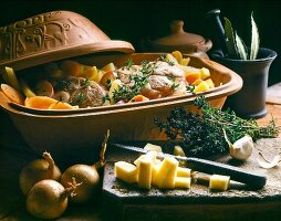 Close-up of veal with pieces on turnips in serving dish