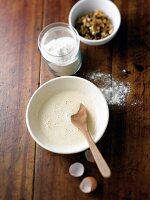 Mixed rum, eggs, sugar and fruit mixture in bowl