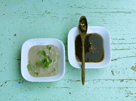 Two bowls of Asian marinades