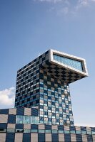 View of University building in blue and white top with projection