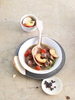 Braised lamb with juniper berries on plate