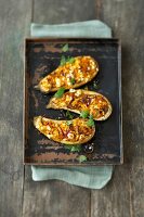 Eggplant with carrot and lentil filling on baking tray