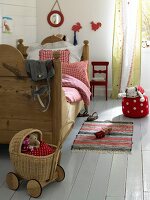View of room with bed and baby doll carriage toy