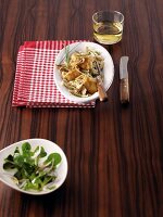 Cheese noodles with veal sweetbreads and lamb's lettuce in bowl