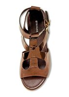 Close-up of brown sandal on white background