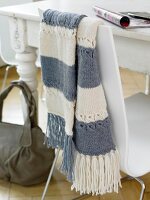 Blue and white striped scarf on white chair