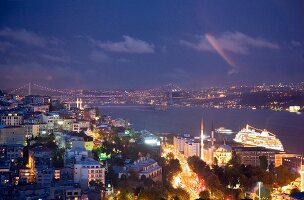 View of cityscape and Bosphorus Bridge at night, Istanbul, Turkey