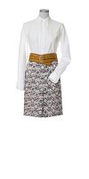 White blouse with patterned skirt and belt on white background