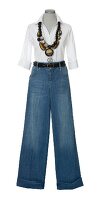 White blouse with wide waist jeans and chain on white background