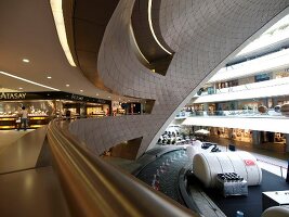 People at futuristic architectured Kanyon shopping mall in Istanbul, Turkey