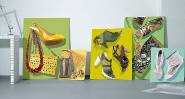 Close-up of variety of sandals on green, yellow and blue background