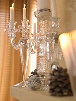 Close-up of pine cones with candle stand on table