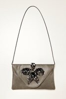Handtasche mit Orchideenblüte aus Metall