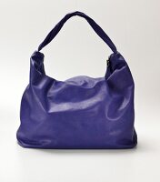 Close-up of Nappa leather purple duffle bag on white background