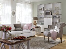 Country style living room with sofa, book shelf and chair