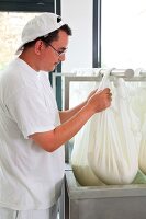 Man looking at bags of cheese