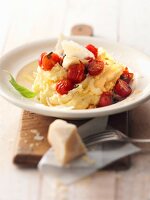 Parmesan with mashed potatoes and melted tomatoes on plate