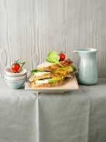 Veggie Sandwich garnished with leaves and tomato