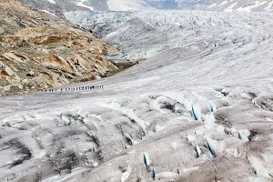 Hikers in Aletsch Glacier, Marjelesee, Valais, Switzerland