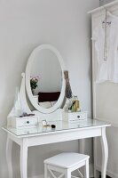 White cosmetic table with mirror in Scandinavian style